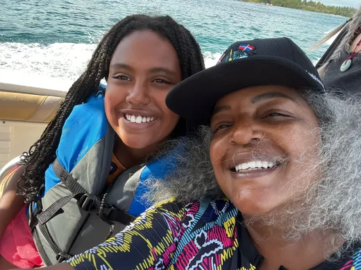 Tami and her daughter on a boat in the Dominican Republic