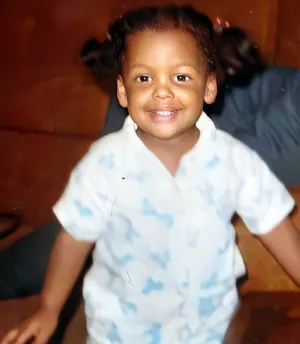 The same photo of Tami as a toddler, enhanced with AI